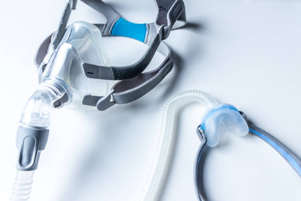 CPAP mask with hose on a white table