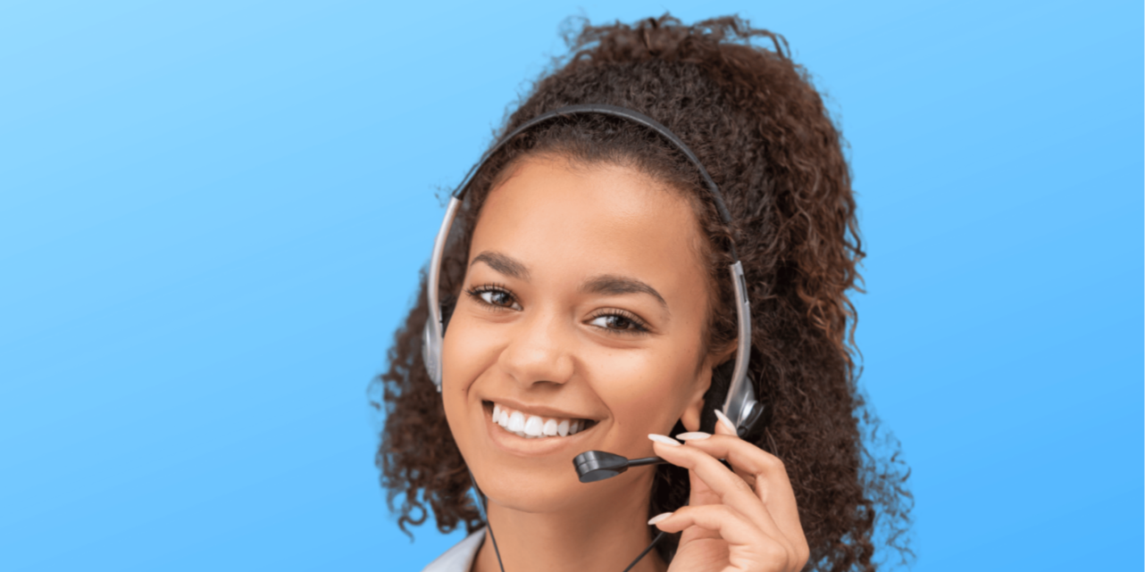Woman wearing a headset against a blue background